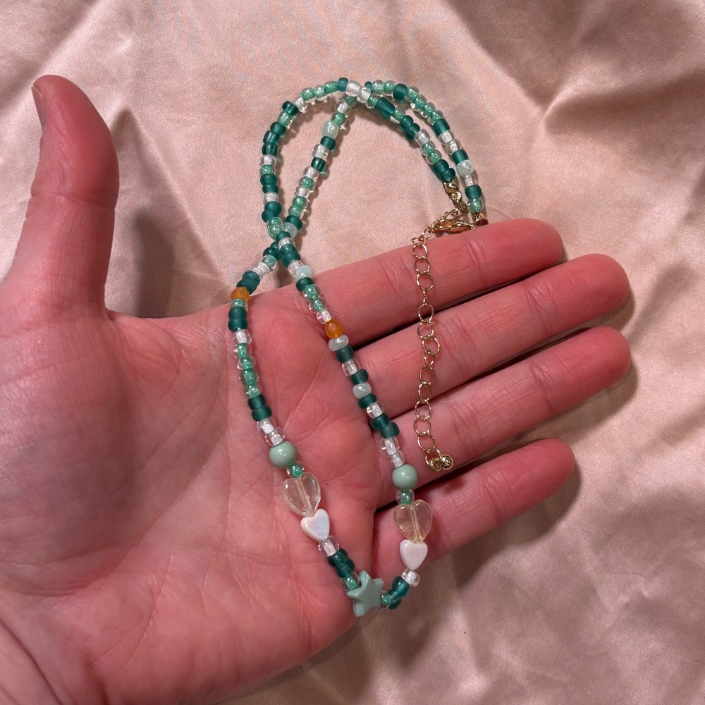 Elegant Beaded Necklace with Heart Accents